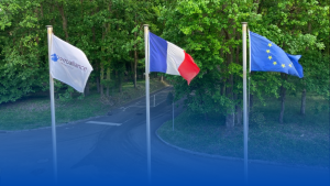 Aligned flags of France, Europe and Pyroalliance on poles in front of the Pyroliance Site